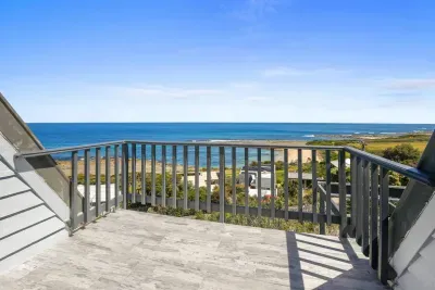 South-facing private master balcony with sweeping ocean views