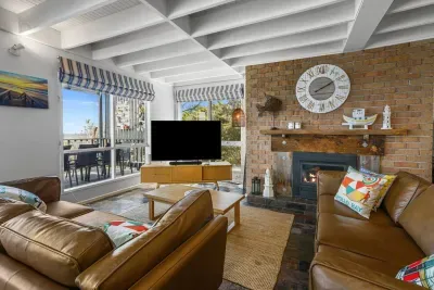 Cozy nights by the fire with floor-to-ceiling ocean views.