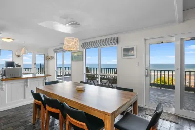 Gather around the dining table with sweeping Southern Ocean views all around