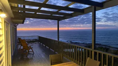Sunrise over the ocean from the expansive deck