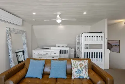 Bedroom 3 offers flexible sleeping with two single beds plus an adult-rated bunk, ideal for families or groups.