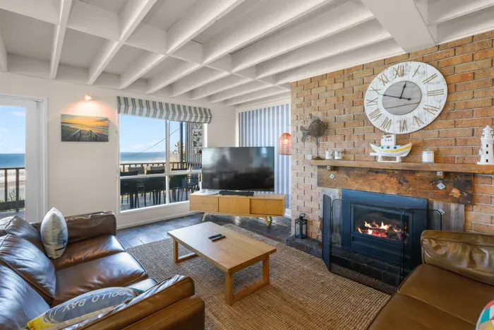 Unwind by the fireplace with sweeping Southern Ocean views from the lounge.