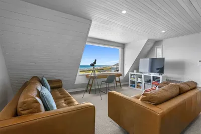 Bright loft with ocean views, telescope, desk, and cozy media nook
