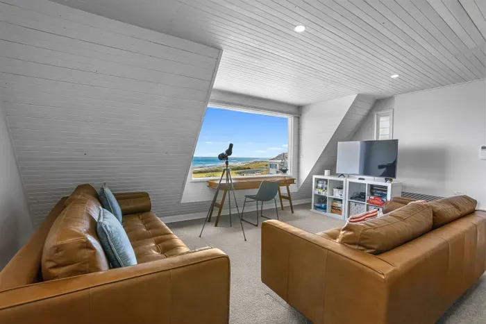 Bright loft with ocean views, telescope, desk, and cozy media nook
