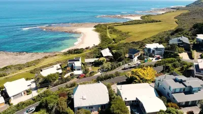 The Marengo coastline from above — Harrison’s Beach, the reef marine sanctuary, and the Great Ocean Walk reserve, all within a 3-minute walk of the front door.