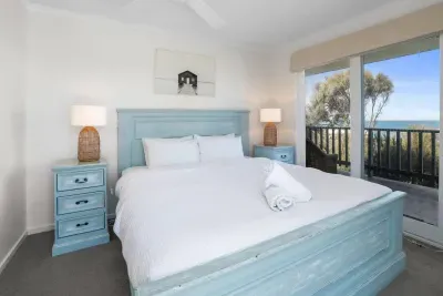 Master bedroom with king bed, quality linen and warm doonas — wake up to the sound of waves from Victoria’s Southern Ocean!