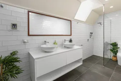 Luxurious Bathroom: Modern fixtures, large double sinks, and natural light create a rejuvenating vibe!
