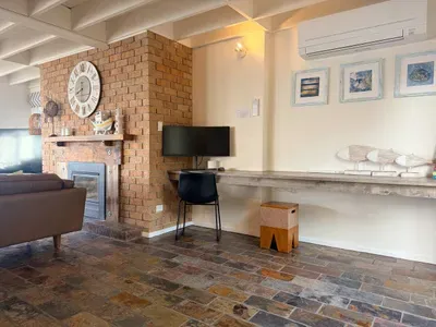 Work with ocean views, unwind by the fire.