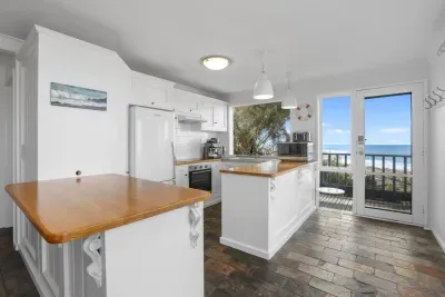 Oceanfront Kitchen: Prepare meals with stunning water views right from your benchtop — a guest favourite!