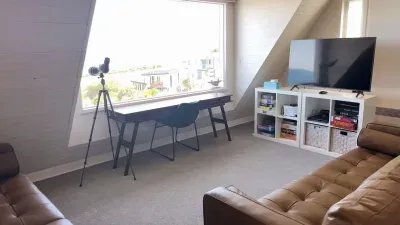 Upstairs retreat with Smart TV, board games, PS4, telescope, and ocean-view workspace — a separate space for kids, teens, or remote workers.