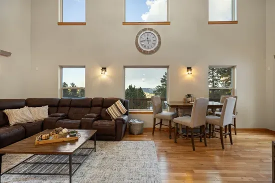 The large couch with recliners is a great place to stretch out and relax.