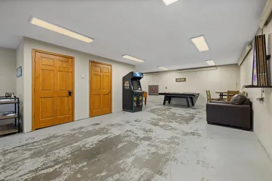 The garage/game room has room for 2 smaller vehicles or 1 crew cab pickup.