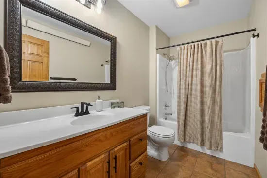 The upstairs primary bathroom has plenty of room for all of your needs.