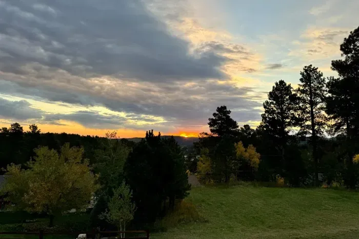 Pour the coffee, step outside, and let the Black Hills do the rest — sunrise from this deck is the moment you'll talk about the whole drive home.