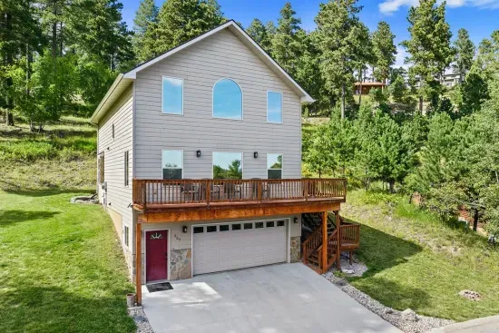 Large windows let nature waft into the spacious living room.