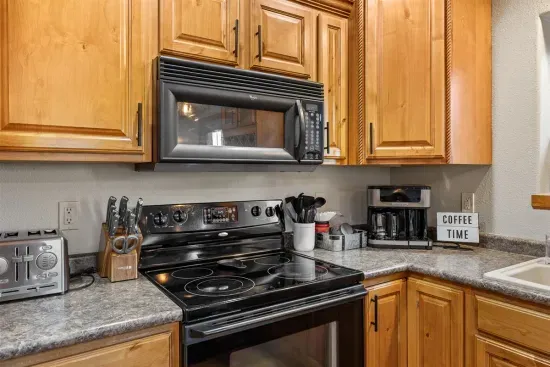 The fully equipped kitchen is perfect for crafting a delicious meal.
