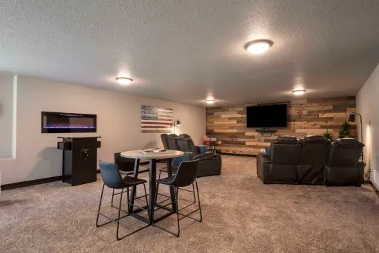 Kick back in the lower-level lounge with reclining seats, a big screen TV, retro 64-game arcade, and table games—perfect for movie nights and friendly competition.