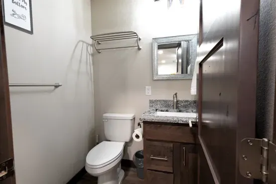 Upper-level half bath located off the loft, providing easy access for the bunk room and upstairs guests.