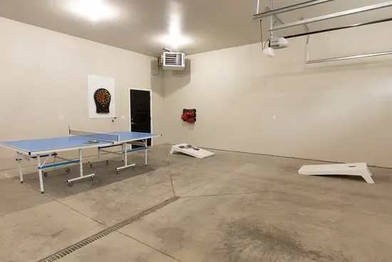 When the day’s adventure winds down, the competition starts—ping pong, darts, and cornhole in the heated garage.