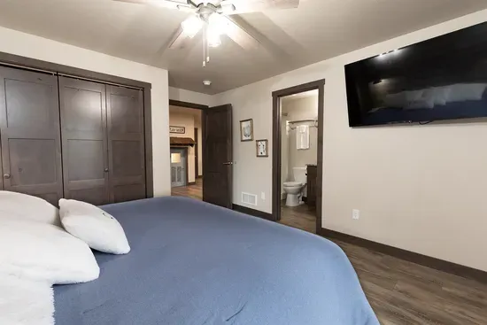 Lower-level king suite with smart TV, large closet, and a private ensuite bathroom. A quiet and comfortable retreat after a day exploring the Black Hills.