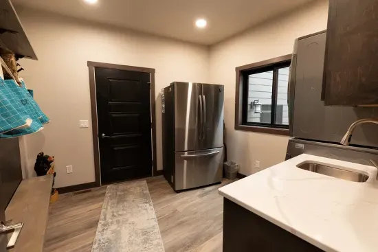 Built for adventure groups. Hang coats, drop packs, keep the trail dust out of the living space—and enjoy the convenience of a bonus fridge.