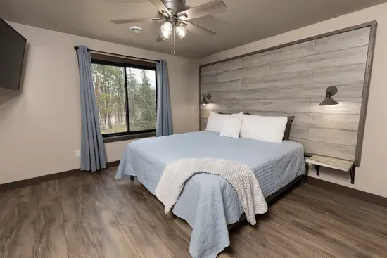 Lower-level king suite with forest views, smart TV, and a private ensuite bathroom. A quiet retreat perfect for relaxing after a day exploring the Black Hills.