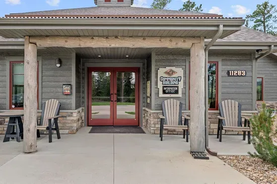 Welcome to the Powder House Pass clubhouse. Guests enjoy access to the year-round heated pool, gathering spaces, and seasonal splash pad—just another perk of staying in this beautiful Black Hills community.