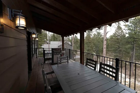Start the morning with coffee on the covered deck, grill dinner after a day on the trails, and watch the forest settle in for the evening.