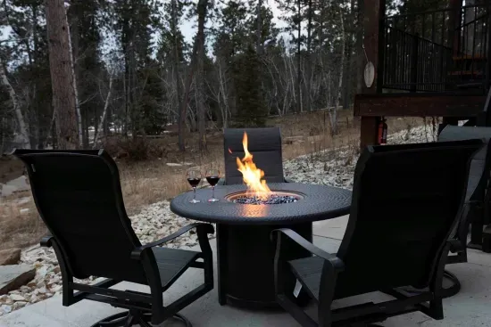 Just a few steps from the hot tub, the fire table is the perfect place to unwind—pour a glass of wine, watch the flames dance, and listen to the quiet of the Black Hills.