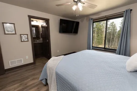 Lower-level king suite with smart TV, large closet, and a private ensuite bathroom. A quiet and comfortable retreat after a day exploring the Black Hills.