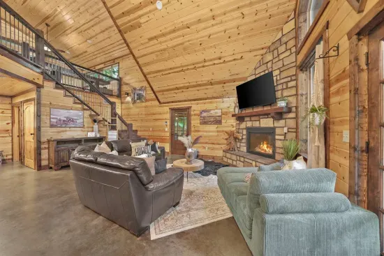 A cozy fire sets the mood in the open living room.