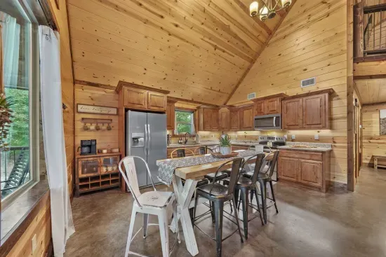 The spacious open plan kitchen lets you prepare meals while engaged in friendly conversation with your group.