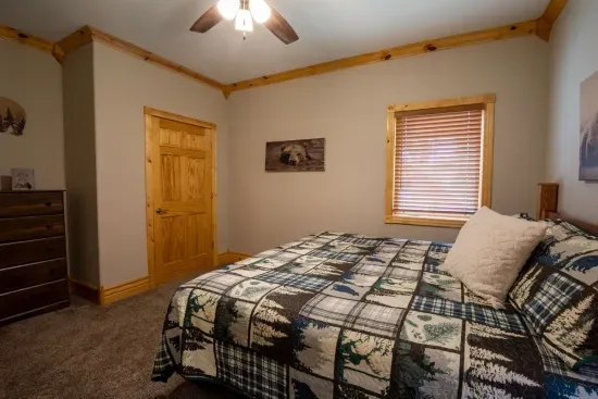 The upstairs king bedroom offers a spacious and serene retreat, perfect for unwinding after a day of adventure.