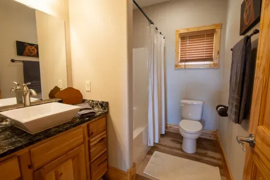 The spacious upstairs full bath offers plenty of room, providing comfort and convenience for your stay.