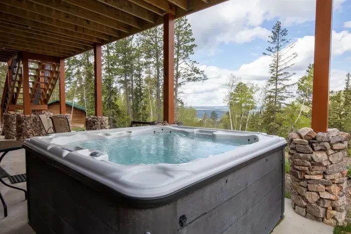 Unwind in the hot tub with stunning canyon views, the perfect way to relax after a day of adventure in the Black Hills.