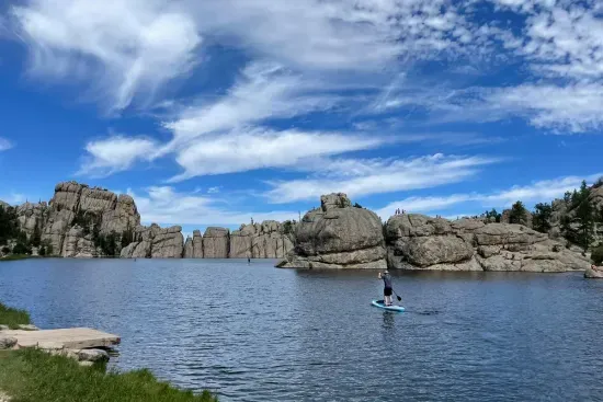 Sylvan Lake features towering boulders along the shoreline, with a flat hiking trail that leads you to the serene back of the lake.