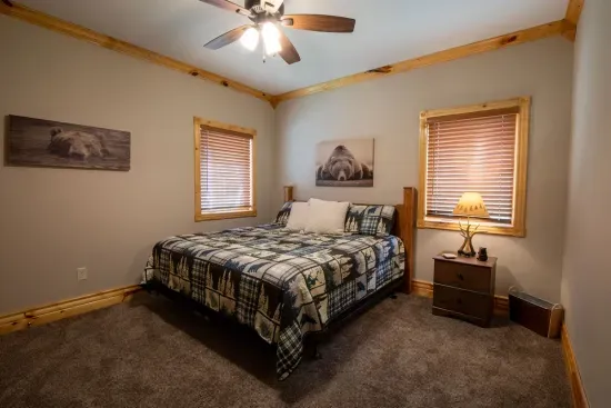 The upstairs king bedroom offers plenty of space, providing a comfortable and relaxing retreat.