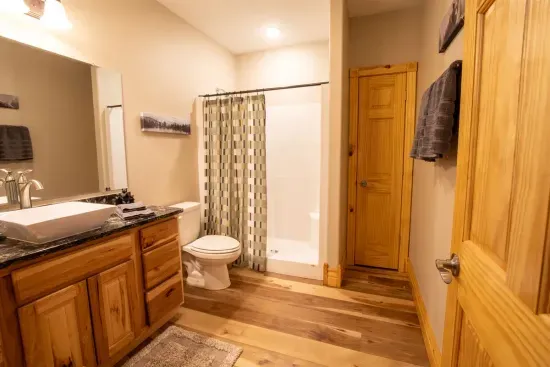 The full bath on the lower level offers plenty of counter space, providing both convenience and comfort.
