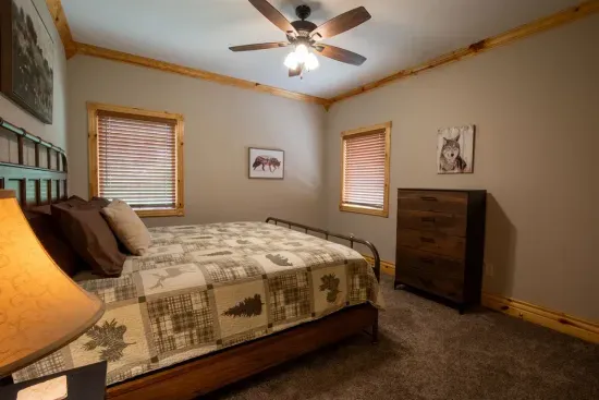 This upstairs king bedroom offers plenty of room, ensuring a comfortable and relaxing space to unwind.