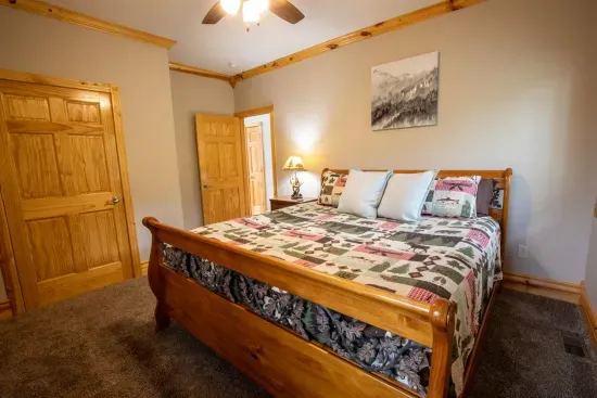 The main floor king bed is generously sized, offering plenty of space for a comfortable and restful night's sleep.