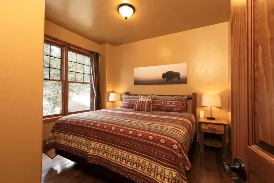 The Primary King Bedroom has an amazingly comfortable mattress and luxurious bedding.