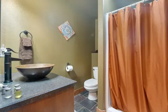 Lower Level Bath with a shower, cozy, fluffy towels and shower amenities provided.
