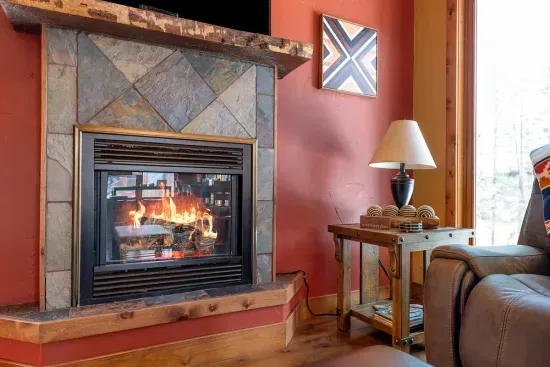 Warm up in front of the gas fireplace after your day's worth of adventures in the Hills.