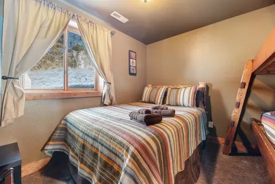 Lower Level Queen With Bunkbeds is perfect for a couple with young kids.  Memory foam mattress and luxurious bedding ensure a great night's sleep.