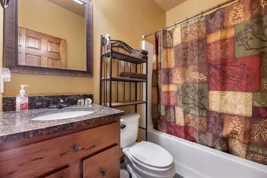 Main Floor Bath with fluffy, cozy towels and shower amenities provided.