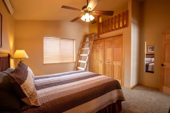 Roomy and spacious, the upstairs queen bedroom with loft provides a comfortable and restful environment for a great night's sleep.