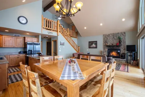 The large dining table and seating around the island provides room for everyone.