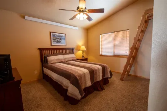 The upstairs queen bedroom includes a charming loft with a double bed, making it a fun and cozy spot that kids will adore.