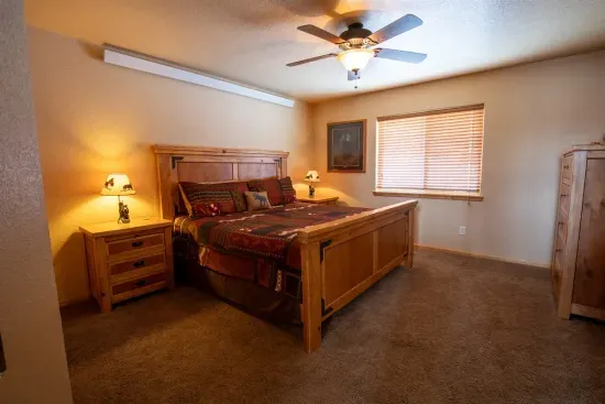 The main level features a spacious and inviting king ensuite bedroom, offering comfort and privacy for a restful stay.