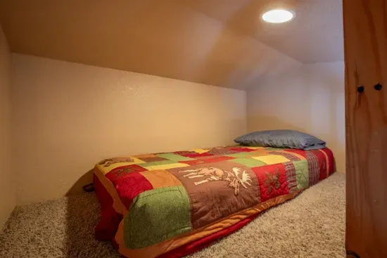 The loft bed is a great area for the kids to sleep.